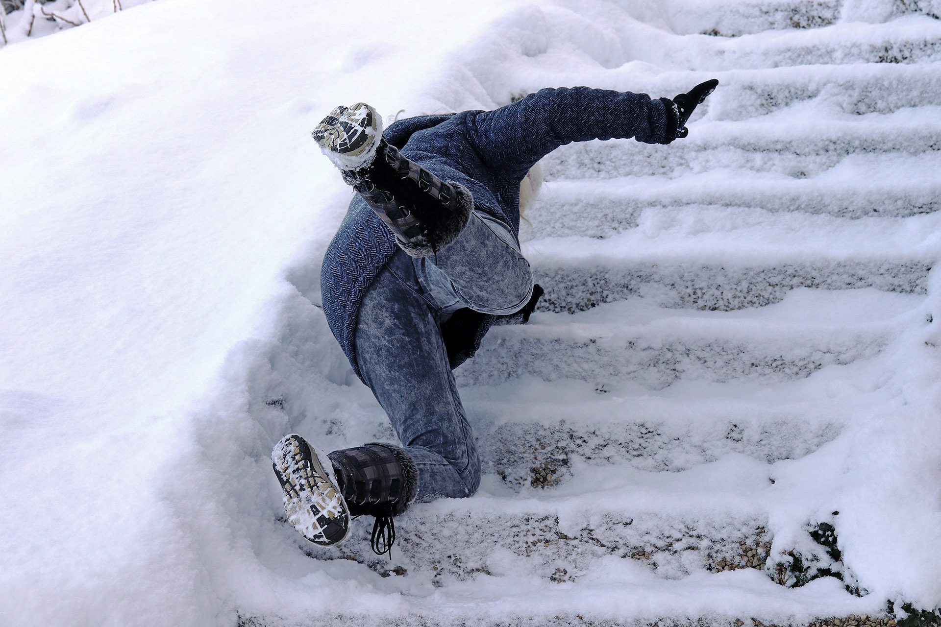 Person Suffering Slip and Fall Upon Icy Stairs